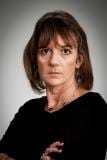 Helen Dewdney stern face arms folded