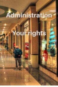 row of shops in shopping mall person walking along Administration your rights