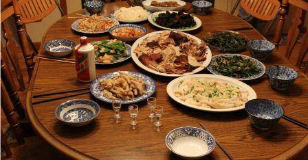 picture of Chinese takeaway food laid out on plates on table