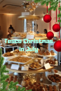 Xmas party food on tiers baubles hanging in corner