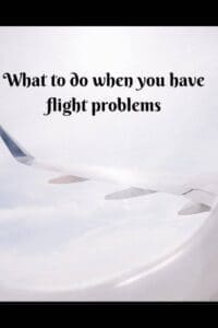 window of aeroplane looking out to wing "What to do when you have a flight problem"
