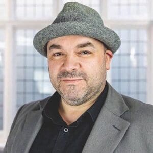 Head shot of Paul Newton in a hat