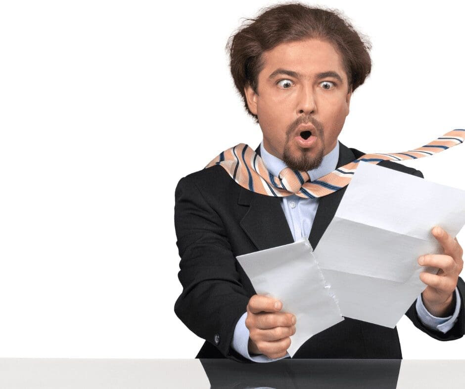 white man tie flying up shocked face at paper in hands