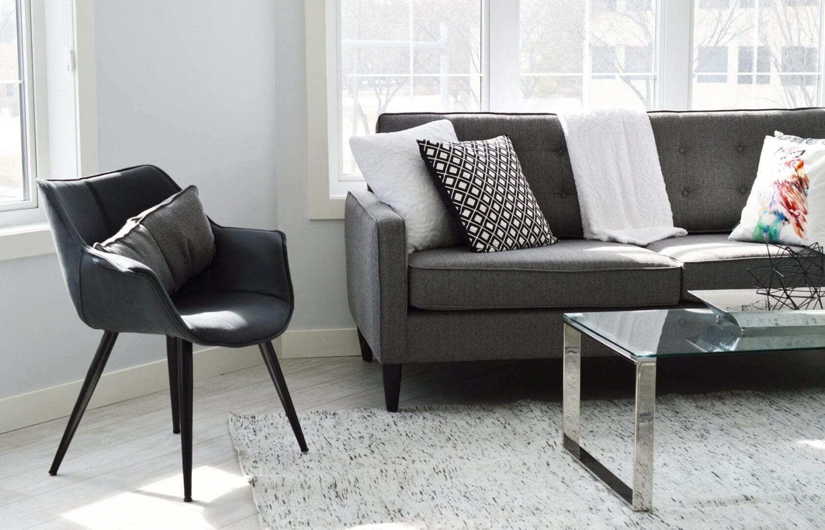 Greay chair and sofas with grey and whitecushions
