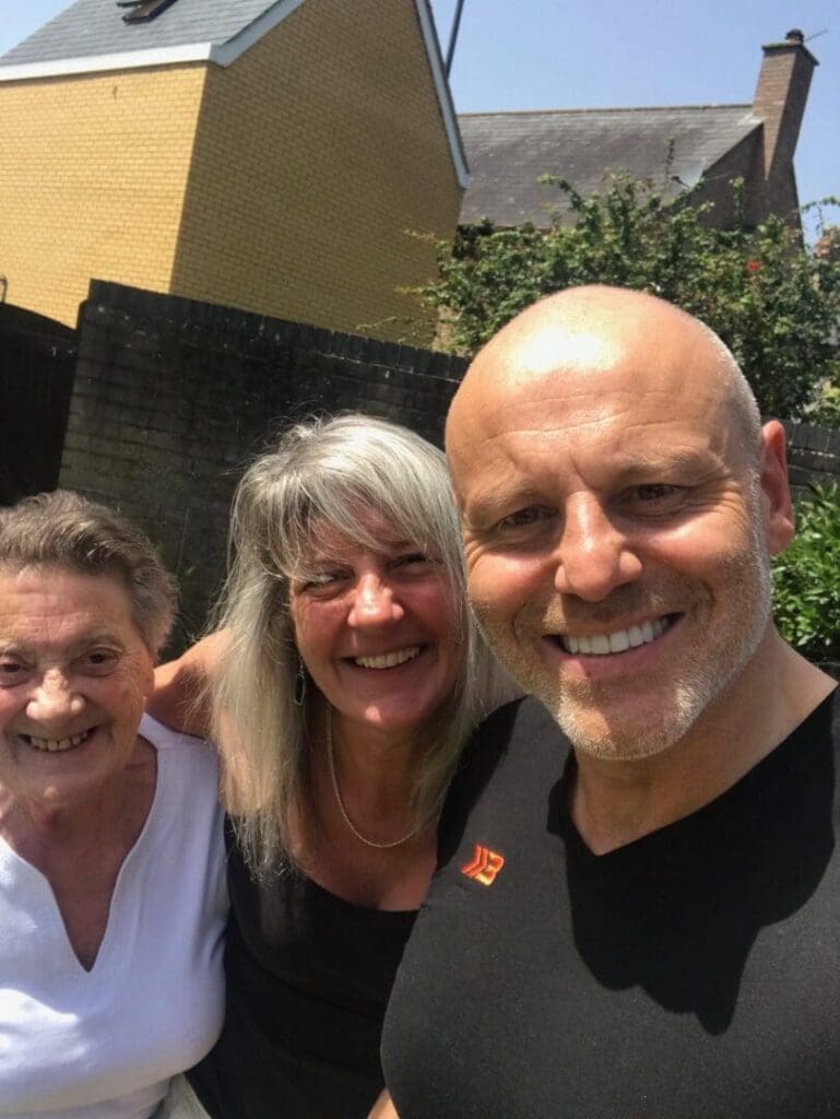 Brad Burton, Helen Dewdney and her mum in the garden