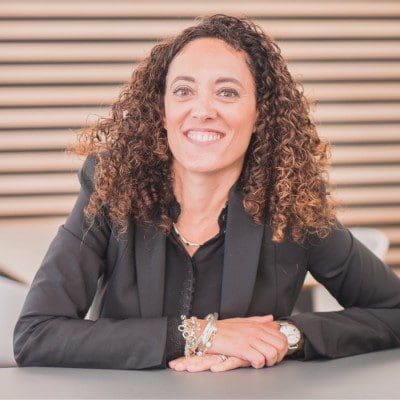 Cristina Luna-Esteban sitting at desk facing camera