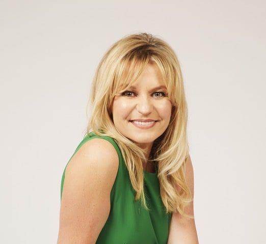 Head shot of Jasmine smiling long blond hair in green top
