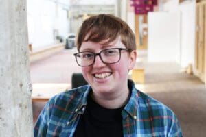 Transgender mail short brown hair with glasses checked shirt
