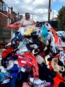 Jennie Sullivan black lady stood behind thousands of bras