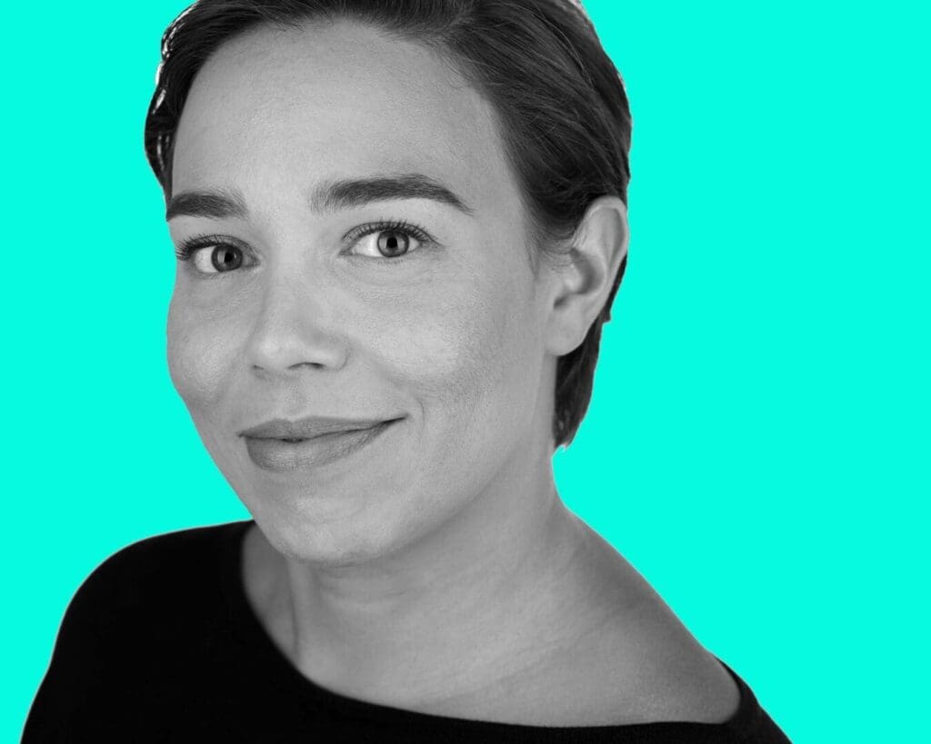 black and white head shot turquoise background