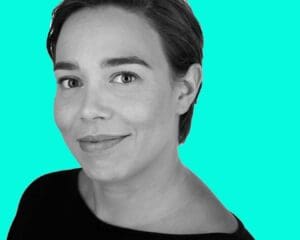 black and white head shot turquoise background
