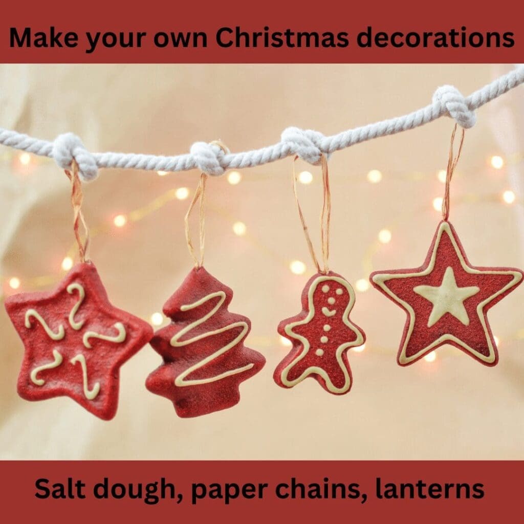 Red Christmas clay ornaments hung on white string