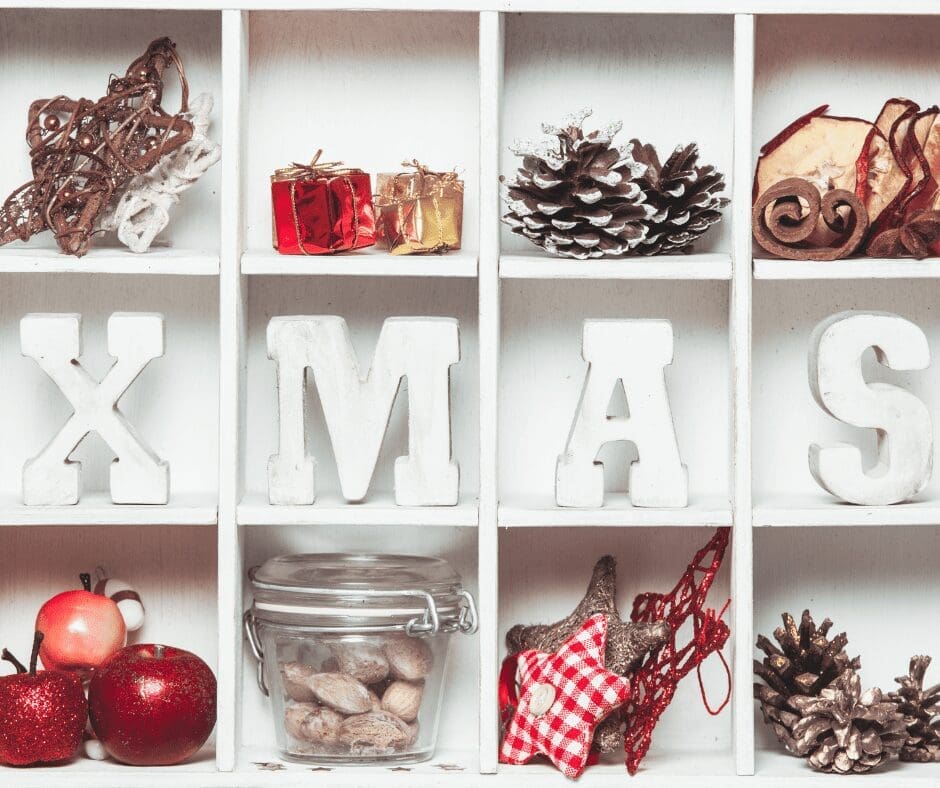 open box sectioned 4x3 Xmas in middle decorations in others