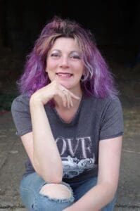 Woman long purple hair in grey t shirt