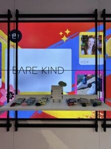 Bare Kind sign pop up table with socks on it