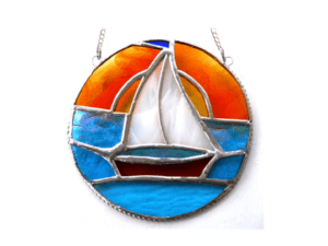 white sail boat orange top and blue bottom