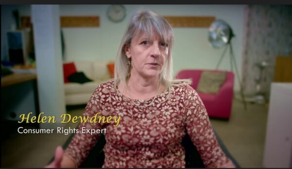 Helen Dewdney, known as The Complaining Cow, wearing a burgundy and cream top while appearing on television to discuss the Glasgow Willy Wonka experience, consumer complaints and refund rights.