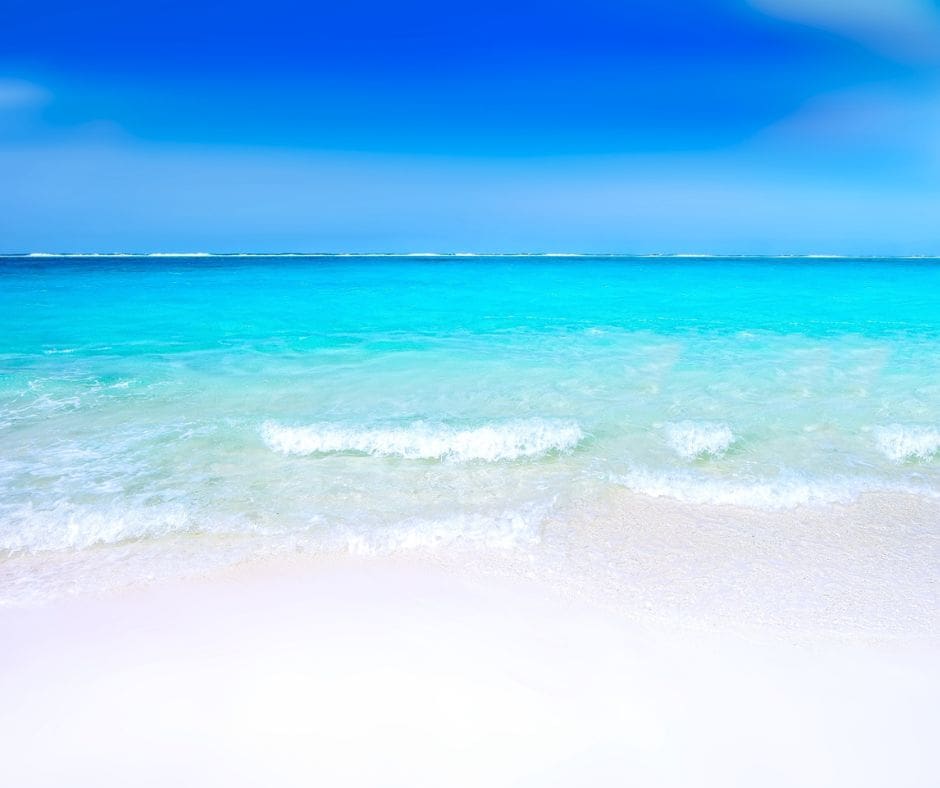 beach calm blue sea white edges blue sky