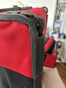 Red case black trim showing damaged whee