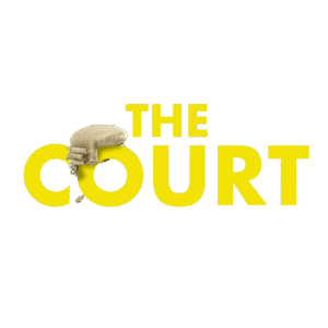 The Court in yello capitals on white background with a barrister's wig on the O
