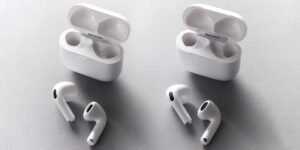 two set of airpods case open ear phones in front looking the same