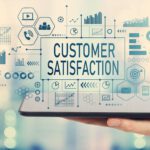 Customer satisfaction with man holding a tablet computer