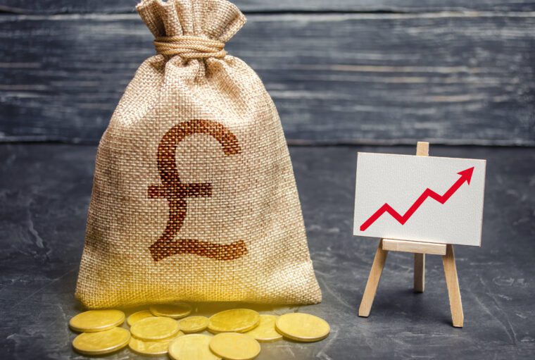 Pound sterling GBP symbol money bag and red trend arrow up chart. Deposit and savings. Increasing profits and revenues, capital growth, profitable business efficiency.