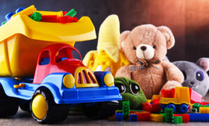 Colorful plastic and plush toys in a children's room.
