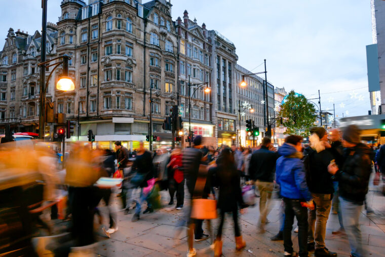 Shopping on Oxford Street London, lots of people with bags